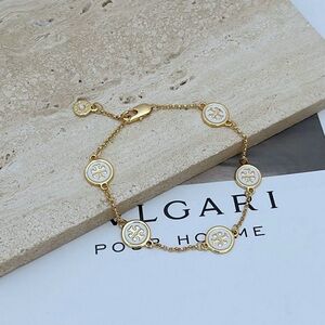 Tory Burch Gold and White Logo Bracelet